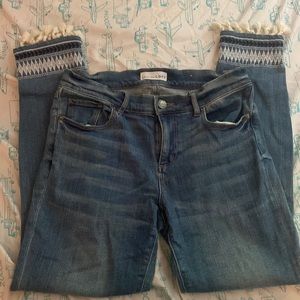 Skinny jeans with embroidered tassel details